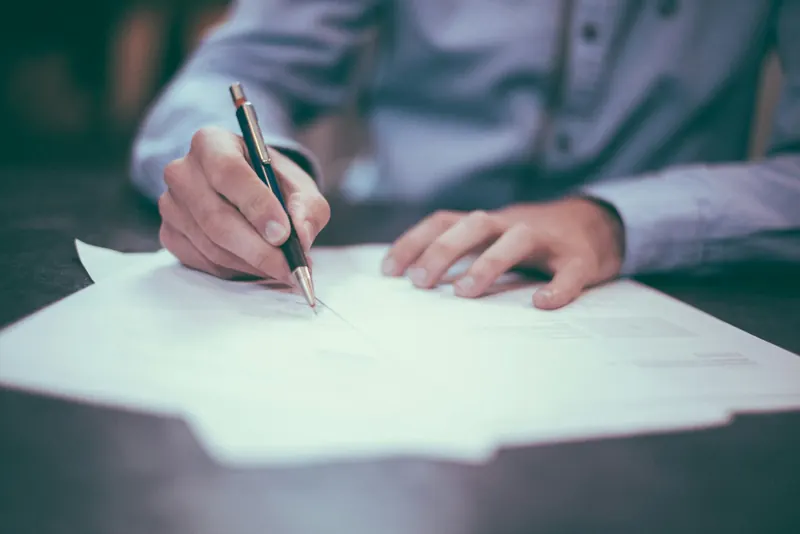 Signing a document with a fountain pen
